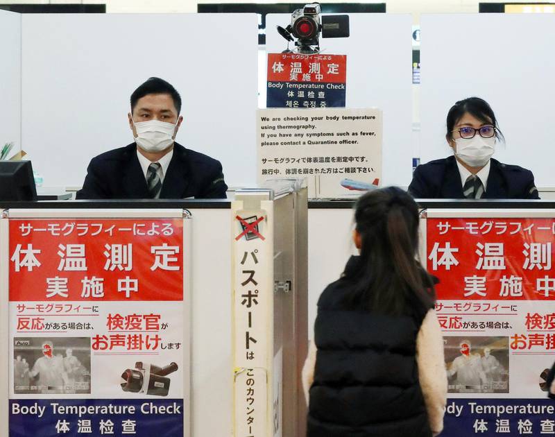 A passenger walks past a quarantine control station at Narita airport in Narita, Japan.  EPA