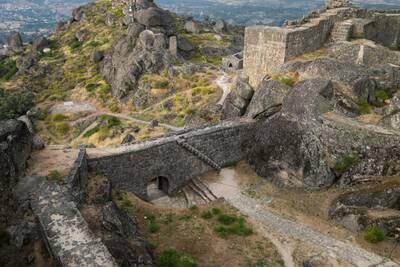 Scenes from 'House of the Dragon' were filmed at Portugal's Castle of Monsanto, a medieval fortress with arched gates and walled courtyards. Getty