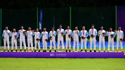 India's men's cricket team players pose with their gold medals at the Asian Games in Hangzhou. AFP