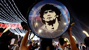 An image that illustrates this article Argentina fans in Doha pay tribute to legend Diego Maradona