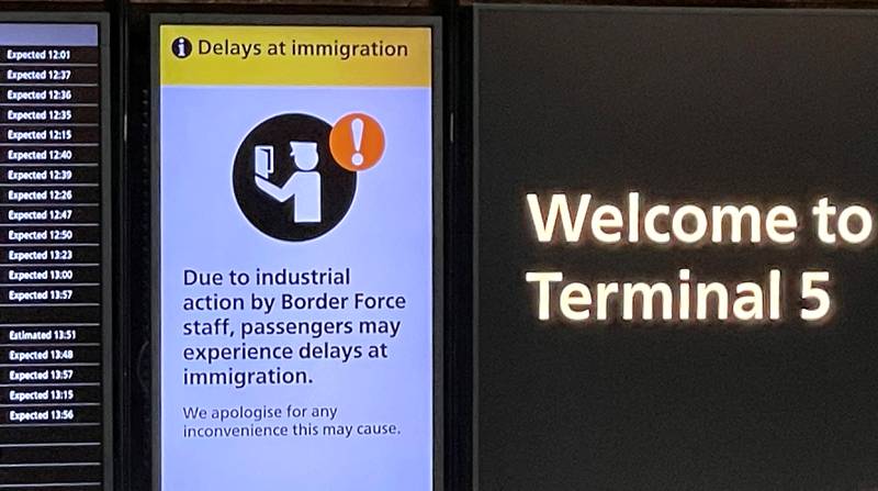 An arrivals board at Heathrow Airport warns of possible delays. Reuters