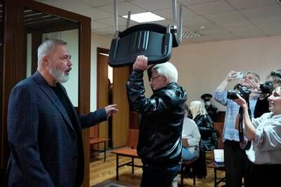Nobel Peace Prize awarded journalist Dmitry Muratov speaks to journalists at a courtroom in Moscow, Russia. AP