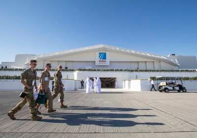 Visitors attend the Dubai Airshow. Leslie Pableo for The National