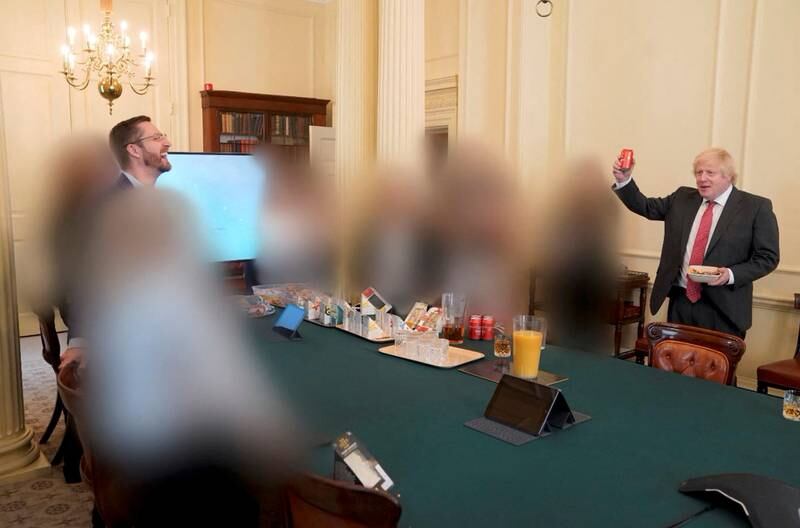 An image released as part of the Sue Gray report showing the cabinet room in 10 Downing Street during British Prime Minister Boris Johnson's birthday. Officials not named in the report were blurred out. Reuters