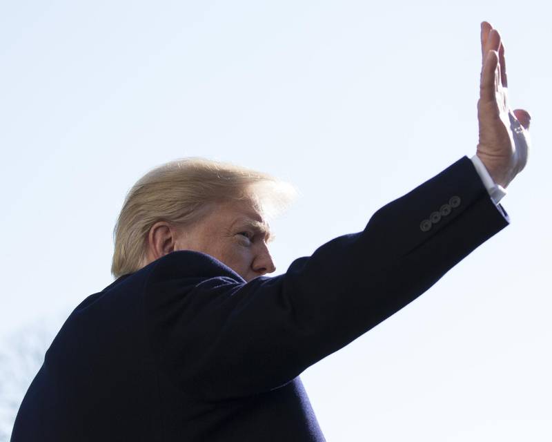 FILE: U.S. President Donald Trump waves while departing for Camp David on the South Lawn of the White House in Washington, D.C., U.S., on Saturday, Dec. 16, 2017. Trump will dominate the Davos forum as no U.S. leader has before: a provocateur-in-chief practiced at tweaking the elites who’ll gather later this month to celebrate the global order he seems eager to tear down. Trump would be the first sitting American president to attend the meeting of bankers, corporate chiefs, academics and investors since Bill Clinton in January 2000. Our editors select the best archive images from Davos and the Trump Presidency. Photographer: Chris Kleponis/Bloomberg
