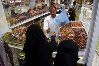 Saudi women shop for dried dates in the Saudi coastal city of Jeddah.  AFP