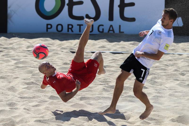 Switzerland's Glenn Hodel goes for the spectacular during the final of the European Beach Soccer League against Germany, held at Nazare, Portugal, on Saturday, September 5. EPA
