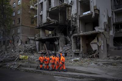 Clean-up crews at the site of an explosion in Kyiv, Ukraine.  Russia struck the Ukrainian capital of Kyiv shortly after a meeting between President Volodymyr Zelenskyy and UN  Secretary General Antonio Guterres. AP