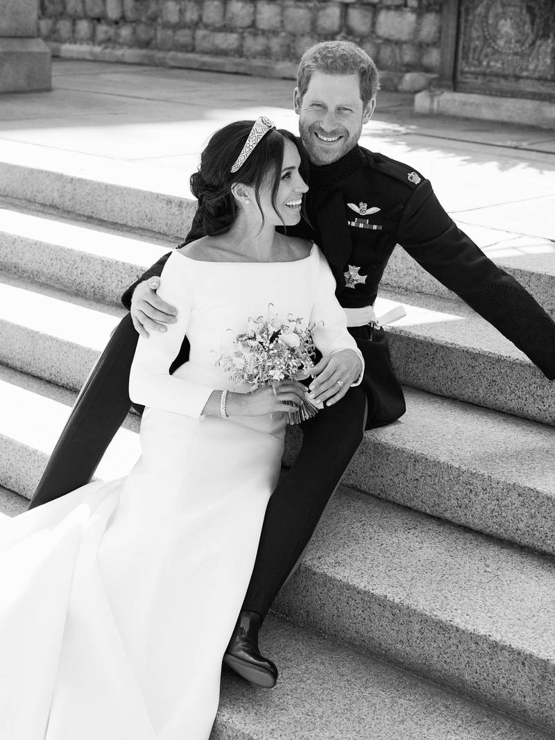 This photo released by Kensington Palace on Monday May 21, 2018, shows an official wedding photo of Britain's Prince Harry and Meghan Markle, on the East Terrace of Windsor Castle, Windsor, England, Saturday May 19, 2018. (Alexi Lubomirski/Kensington Palace via AP)