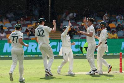Australia paceman Pat Cummins celebrates the wicket of India batsman Cheteshwar Pujara. AFP