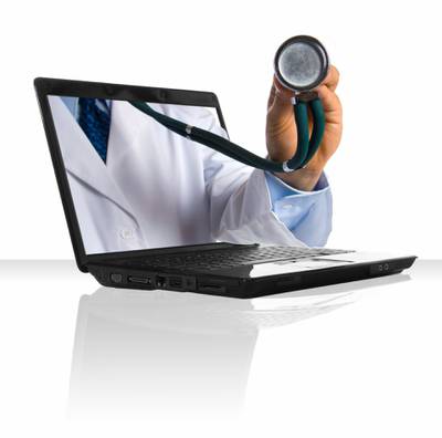 A doctor's hand sticking out of a laptop.Credit: Yanik Chauvin/iStockPhoto.com