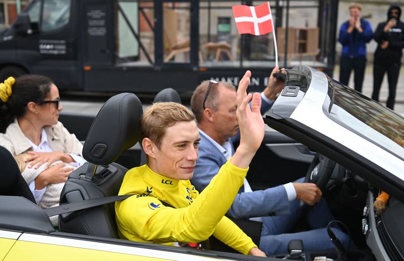 Jumbo-Visma rider Jonas Vingegaard waves to fans in Copenhagen. AFP