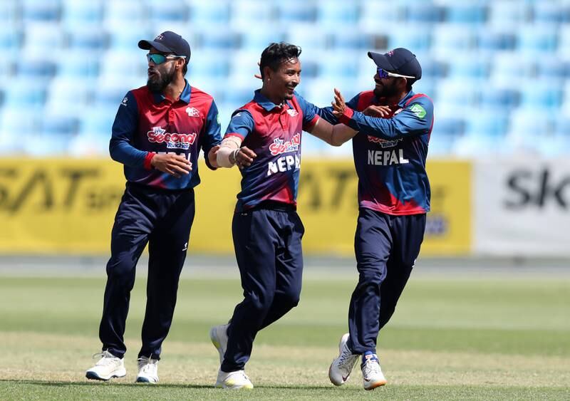 Nepal's Sompal Kami celebrates taking the wicket of PNG's Lega Siaka during their World Cup League 2 match at the Dubai International Stadium on Tuesday, March 22, 2022. All images Chris Whiteoak / The National