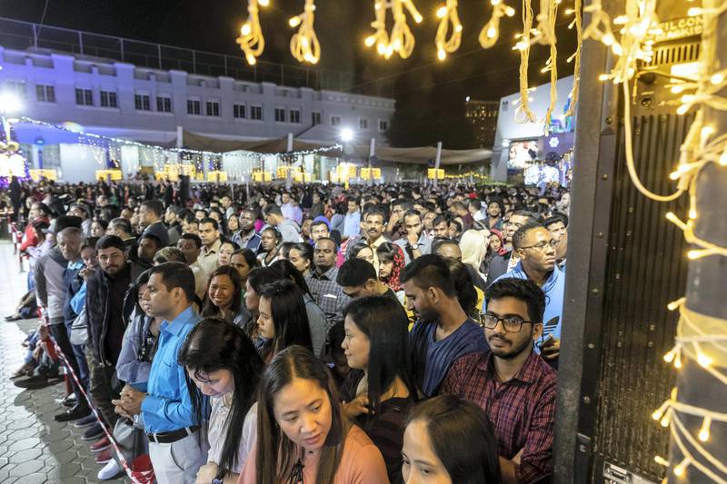 DUBAI, UNITED ARAB EMIRATES. 25 DECEMBER 2019. Midnight Mass at St Mary’s in Dubai to celebrate Christmas. People stand patiently during the ceremony. (Photo: Antonie Robertson/The National) Journalist: None. Section: National.