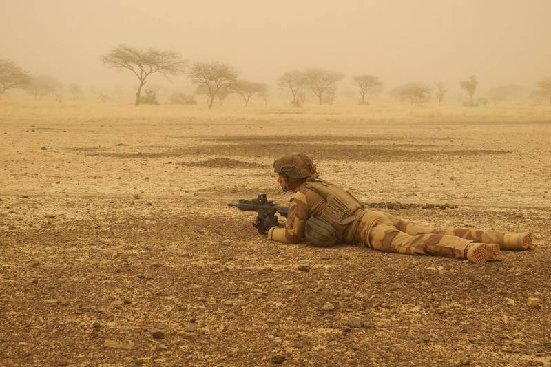 A French soldier secure a perimeter during a break in the military convoy's trip between Gossi and Hombori in March. AFP