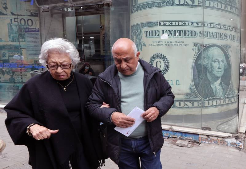 A couple outside a currency exchange bureau in Cairo on Wednesday. EPA