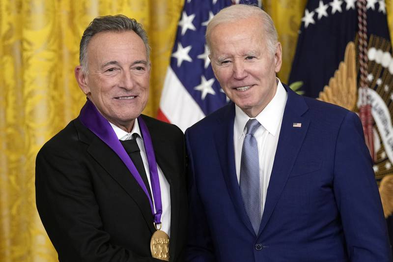 Mr Biden presents the 2021 National Medal of the Arts to musician Bruce Springsteen. AP