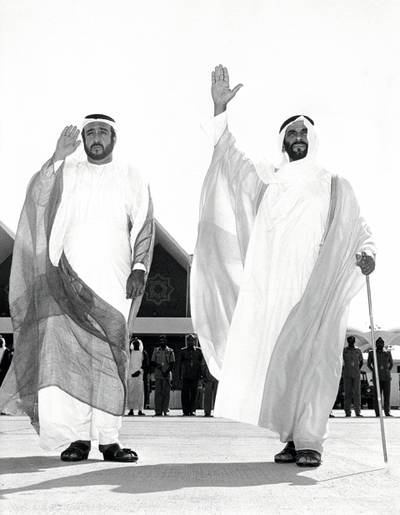 Undated photograph showing (right-left) Sheikh Zayed and his son Sheikh Khalifa. Courtesy Al Ittihad. 