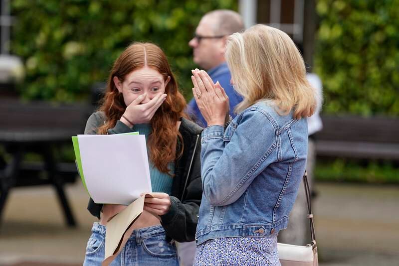 Annabel Bolton receives her GCSE results with her mother Helen at Portsmouth Grammar School. PA