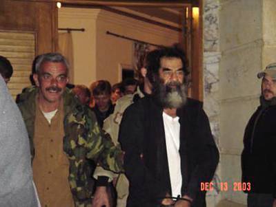 Saddam Hussein at an unknown location in Iraq following his capture by US troops on  December 13, 2003. AFP