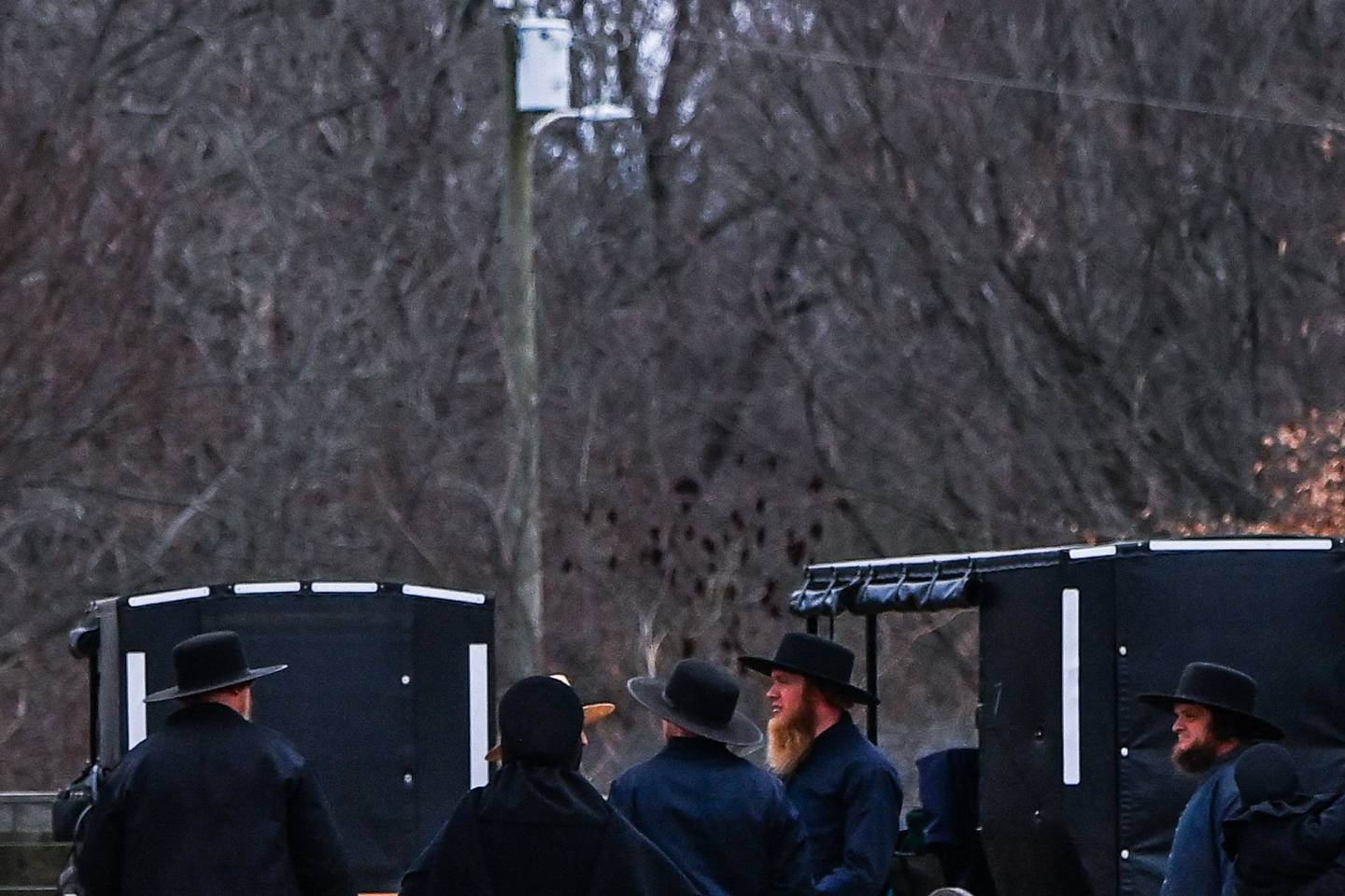 Amish people near a lumber yard in Kentucky last December. With certain exceptions, humans are not like 18th-century folks with smart phones. AFP