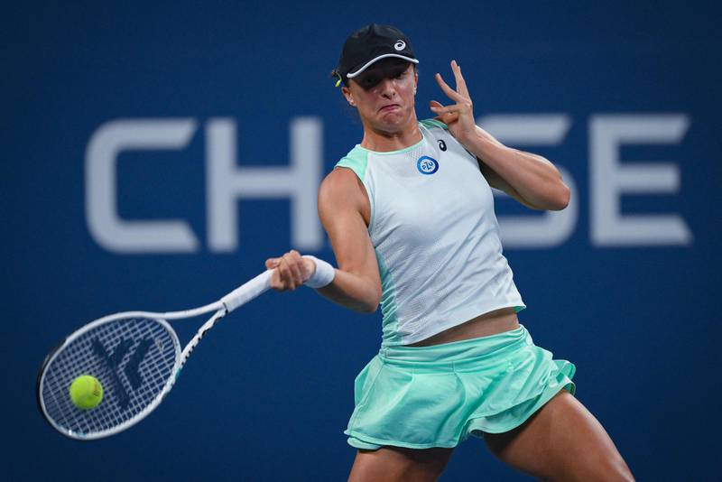 Iga Swiatek hits a return to Lauren Davis during their third round match at the US Open. AFP