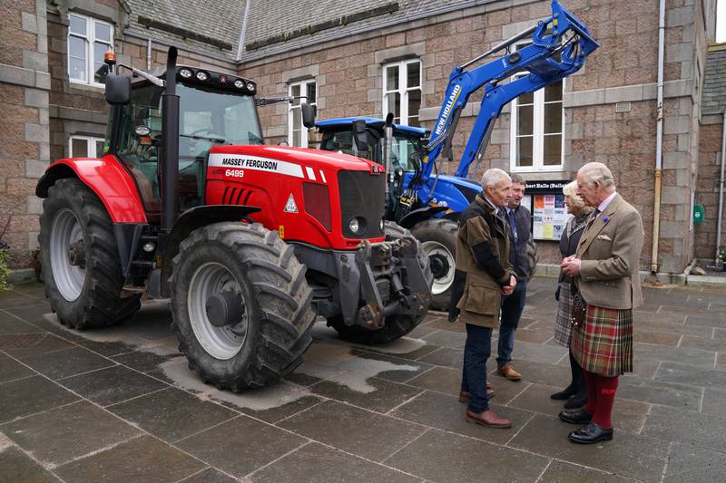 King Charles and Camilla meet farmers with their tractors. PA