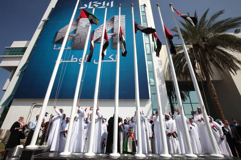 Here in Abu Dhabi, we raise UAE flags outside the Abu Dhabi Media head office. Brian Kerrigan / The National
