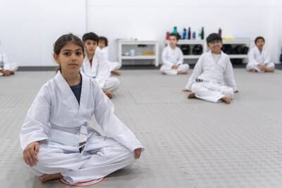 Children attend a class at the Warrior Academy's new dojo in Al Wahda Mall