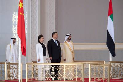 ABU DHABI, UNITED ARAB EMIRATES - July 19, 2018: HH Sheikh Mohamed bin Rashid Al Maktoum, Vice-President, Prime Minister of the UAE, Ruler of Dubai and Minister of Defence (R), and HE Xi Jinping, President of China (2nd R), stand for the national anthem, during a reception held at the Presidential Airport. Seen with HH Sheikh Mohamed bin Zayed Al Nahyan, Crown Prince of Abu Dhabi and Deputy Supreme Commander of the UAE Armed Forces (L) and Peng Liyuan, First Lady of China (3rd R).

( Saeed Al Neyadi / Crown Prince Court - Abu Dhabi )
---