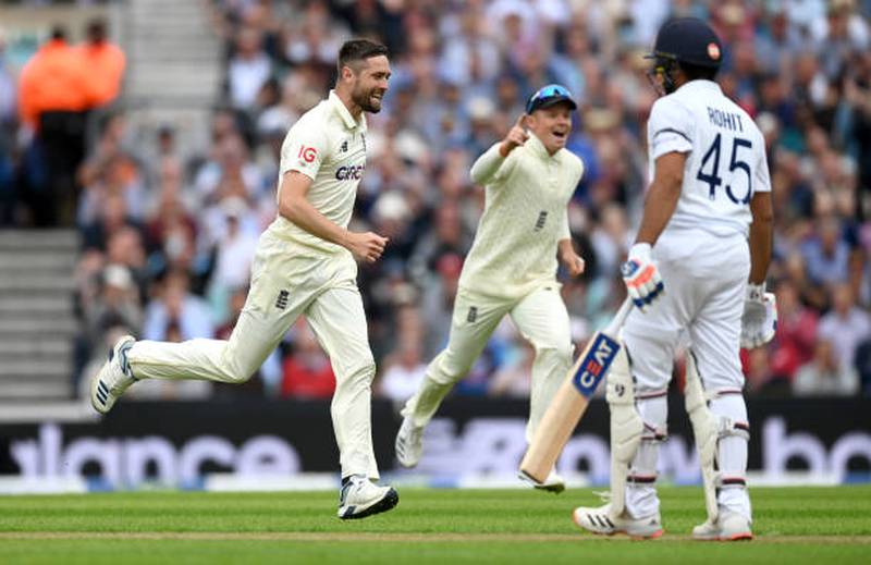 England bowler celebrates Chris Woakes dismissing Rohit Sharma of India for 11. Getty