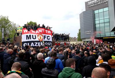 Fans protest against the Glazer family before Manchester United's match against Liverpool. PA