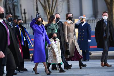US Vice President Kamala Harris, husband Doug Emhoff, her great niece Amara, and family members walk the abbreviated parade route after US President Joe Biden's inauguration. AFP