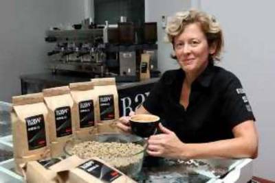 

DUBAI, UNITED ARAB EMIRATES ñ July 20: Kim Thompson, Managing Director of the Raw Coffee Company with some of the coffee products at Dubai investments park, Dubai. (Pawan Singh / The National) *** Local Caption ***  PS003-KIM.jpgPS003-KIM.jpg