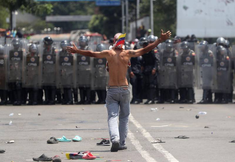 Opposition protesters face the Venezuelan Police at the Simon Bolivar International Bridge in Cucuta, Colombia. EPA
