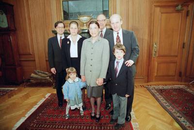 Ruth Bader Ginsburg poses with her family at the Supreme Court in Washington. From left are, son-in-law George Spera, daughter Jane Ginsburg, husband Martin, son James Ginsburg. The judge's grandchildren Clara Spera and Paul Spera are in front. AP Photo