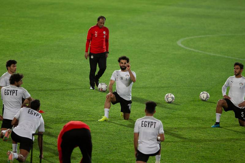 Mohamed Salah, centre, stretches during a training session for the Egypt national team in Cairo ahead of the Africa Cup of Nations qualification match against Kenya.