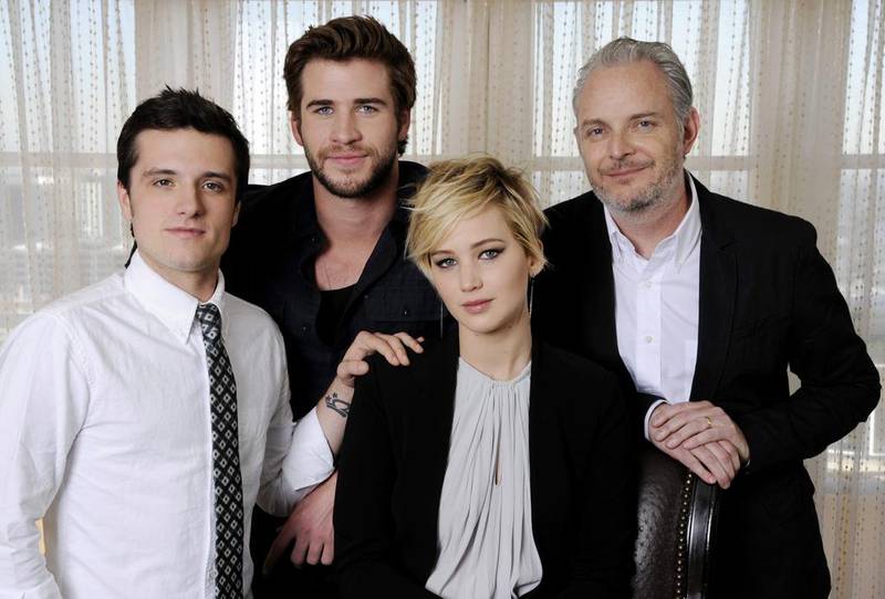 From left, Josh Hutcherson, Liam Hemsworth and Jennifer Lawrence with The Hunger Games: Catching Fire director Francis Lawrence. Chris Pizzello / AP Photo