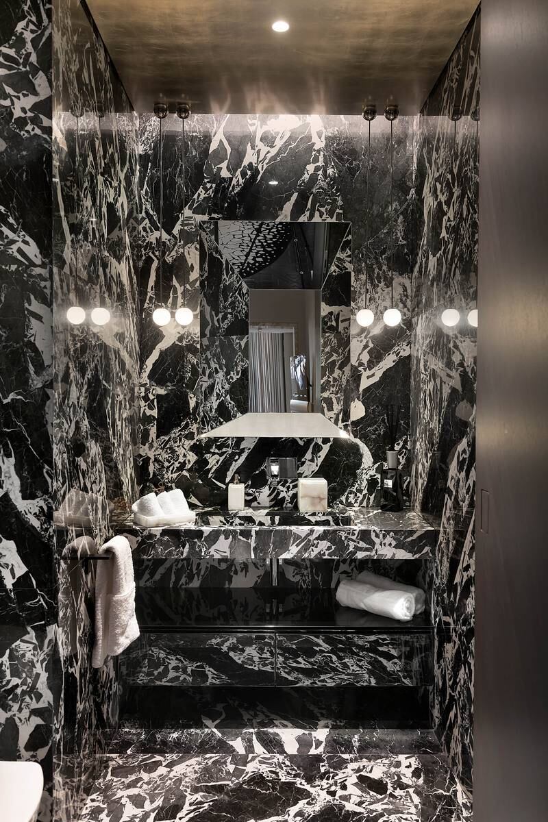 A marble-decorated bathroom.