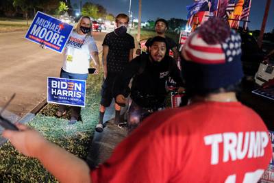 Biden supporters face off a Trump supporter outside of a polling site, on Election Day in Houston, Texas, U.S. November 3, 2020. Reuters