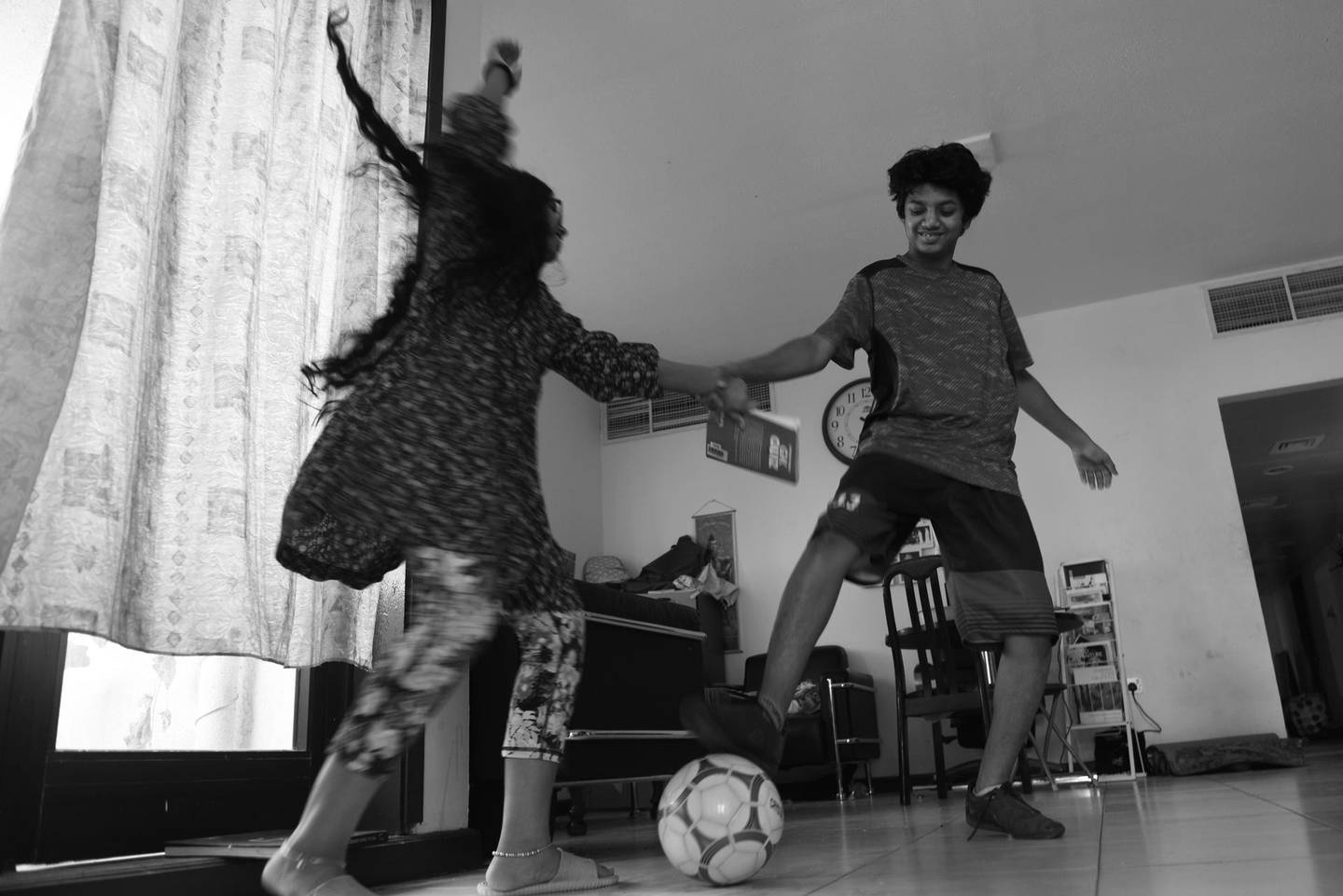 Vidhyaa Chandramohan's children playing football in the living room of their Abu Dhabi flat. Vidhyaa Chandramohan