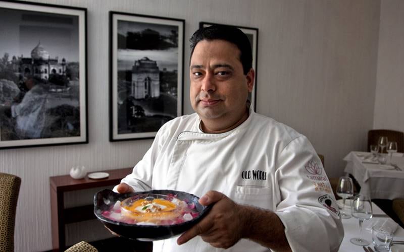 31 May 2102, New Delhi, India:  Renowned chef Manish Mehrotra, of Indian Accent restaurant in the Manor Hotel, with his mango dessert of fresh Alphonso Aamras, Coconut and Jaggery ice cream, puffed rice candy. The dessert made from traditional ingredients includes one of the highest priced mangoes in the country, the Alphonso.  The low yield of mango this year is driving up prices in India.  Picture by Graham Crouch/The National