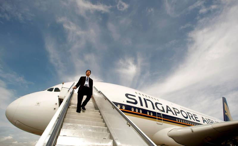 FILE PHOTO: A Singapore Airlines staff member walks down a set of stairs from an Airbus A380 at Sydney International Airport October 26, 2007.       REUTERS/Tim Wimborne/File Photo