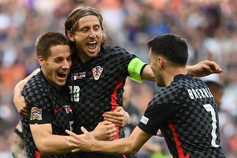 Croatia midfielder Luka Modric, centre, celebrates scoring from the penalty spot in the Nations League, League A Group 1 match against France at the Stade de France in Saint-Denis, on the outskirts of Paris on June 13, 2022. Croatia won the match 1-0. AFP