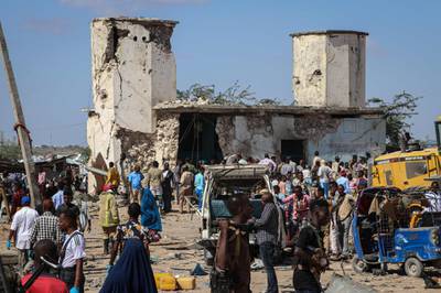 People gather at a car bombing attack site in Mogadishu. AFP