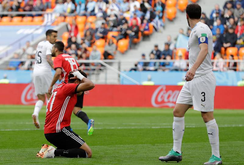 Egypt's Trezeguet, left, reacts after missing a scoring chance during their group A match at the 2018 FIFA World Cup at the Yekaterinburg Arena in Yekaterinburg, Russia, on June 15, 2018. Natacha Pisarenko / AP Photo