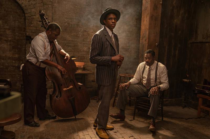 This image released by Netflix shows Michael Potts, from left, Chadwick Boseman and Colman Domingo in "Ma Rainey's Black Bottom." Boseman won the award for best actor in a motion picture drama at the Golden Globes on Sunday, Feb. 28, 2021. (David Lee/Netflix via AP)