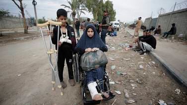 Injured Palestinians cross from the northern Gaza Strip to the south after Israel and Hamas agreed to a temporary truce. EPA