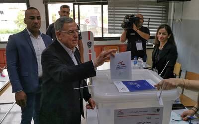 Former Lebanese prime minister Fouad Siniora casts his vote at a polling station during the parliamentary election, in Sidon, southern Lebanon. Reuters