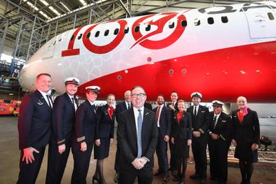Qantas CEO Alan Joyce, centre, poses for a photograph with the crew of QF7879. EPA